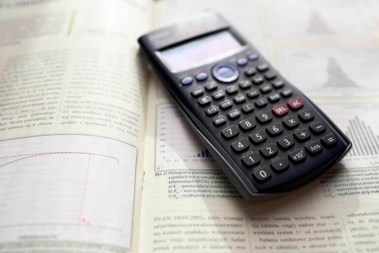 calculator on an open textbook